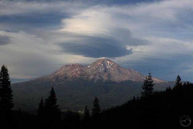 Mount Shasta City visible below clouds and mountain.
