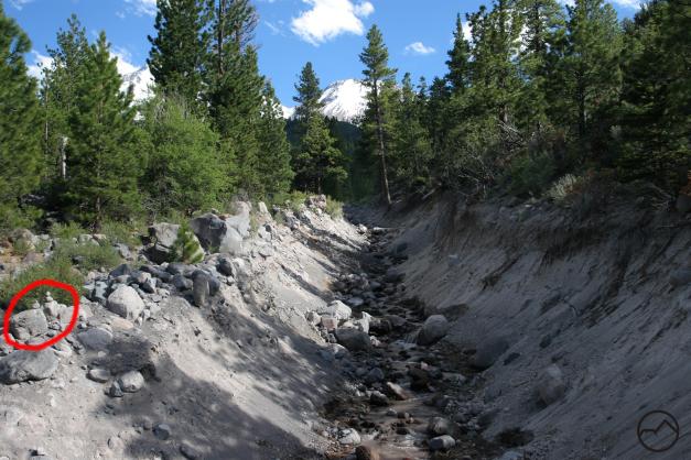 The crossing in pre-washout condition. Note the circled rocks for reference.