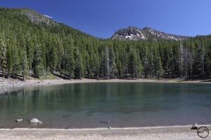 Ash Creek Butte rises above Surprise Lake, part of the remains of an ancient glacier